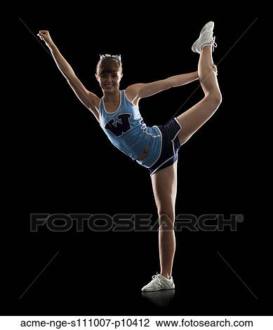 Portrait of teenage cheerleader girl (16-17) stretching View Large Photo Image Stock Image - Portrait of teenage cheerleader girl (16-17) stretching. Fotosearch