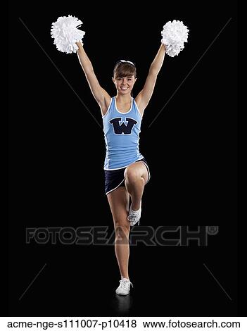 Portrait of teenage cheerleader girl (16-17) holding pom-poms View Large Photo Image Stock Photo - Portrait of teenage cheerleader girl (16-17) holding pom-poms. Fotosearch