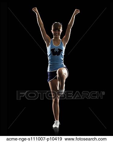 Portrait of teenage cheerleader girl (16-17) stretching View Large Photo Image Stock Photo - Portrait of teenage cheerleader girl (16-17) stretching. Fotosearch