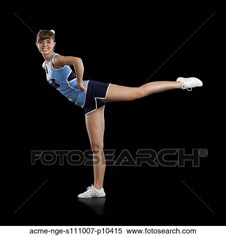 Portrait of teenage cheerleader girl (16-17) stretching View Large Photo Image Stock Photography - Portrait of teenage cheerleader girl (16-17) stretching. Fotosearch