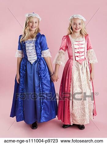 Portrait of two girls (10-11) in colonial princess dresses for Halloween View Large Photo Image Stock Image - Portrait of two girls (10-11) in colonial princess dresses for Halloween. Fotosearch