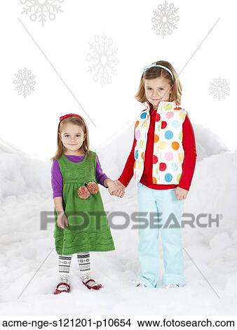 Portrait of two girls (18-23 months, 6-7) holding hands View Large Photo Image Picture - Portrait of two girls (18-23 months, 6-7) holding hands. Fotosearch