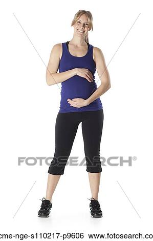 Portrait of young pregnant woman in sports clothing, studio shot View Large Photo Image Stock Photograph - Portrait of young pregnant woman in sports clothing, studio shot. Fotosearch