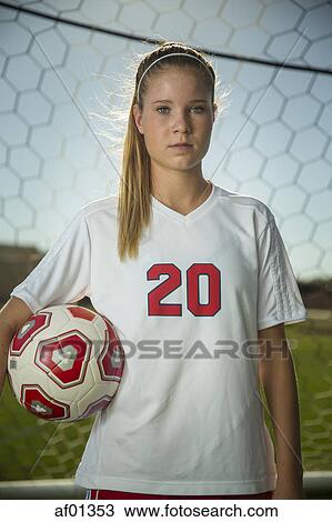 Proud goalie holding soccer ball in goal on sunny day View Large Photo Image Stock Image - Proud goalie holding soccer ball in goal on sunny day. Fotosearch