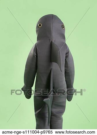 Rear view of boy (6-7) in shark costume for Halloween View Large Photo Image Stock Photography - Rear view of boy (6-7) in shark costume for Halloween. Fotosearch