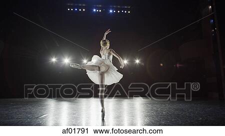 Rear view of serious ballet dancer in costume performing onstage in show View Large Photo Image Stock Image - Rear view of serious ballet dancer in costume performing onstage in show. Fotosearch