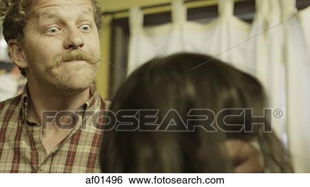 Selective focus blurred view of abusive boyfriend holding girlfriend's head ready to strike in kitchen View Large Photo Image Stock Photograph - Selective focus blurred view of abusive boyfriend holding girlfriend's head ready to strike in kitchen. Fotosearch