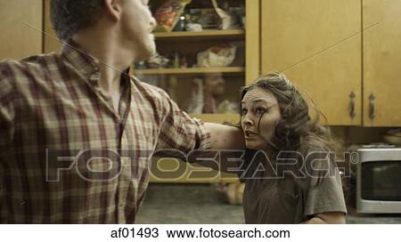 Selective focus blurred view of scared girlfriend with abusive boyfriend ready to strike in kitchen View Large Photo Image Stock Image - Selective focus blurred view of scared girlfriend with abusive boyfriend ready to strike in kitchen. Fotosearch