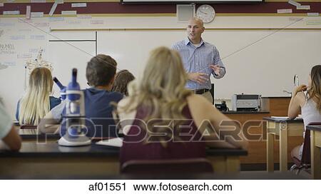 Selective focus view of teacher instructing students in science lab classroom View Large Photo Image Stock Image - Selective focus view of teacher instructing students in science lab classroom. Fotosearch