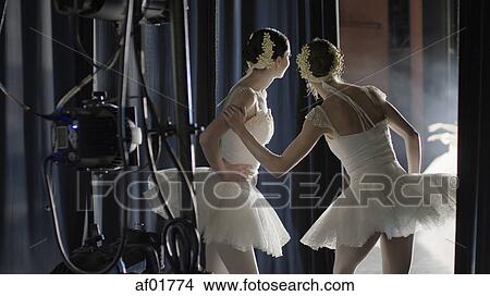 Serious ballet dancers in costume watching performance backstage during show View Large Photo Image Picture - Serious ballet dancers in costume watching performance backstage during show. Fotosearch
