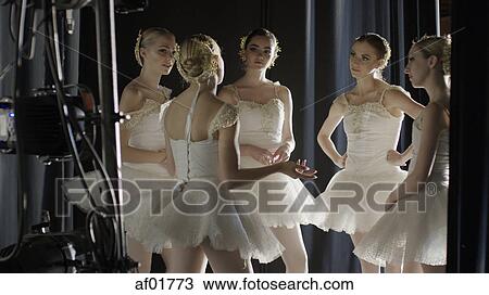 Serious ballet dancers in costume standing backstage during show View Large Photo Image Stock Image - Serious ballet dancers in costume standing backstage during show. Fotosearch