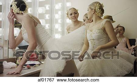 Serious ballet dancers in costume talking and preparing backstage before show View Large Photo Image Stock Photo - Serious ballet dancers in costume talking and preparing backstage before show. Fotosearch