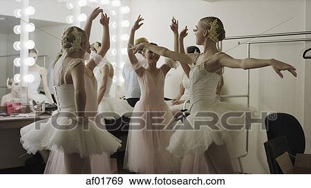 Serious ballet dancers in costume rehearsing backstage before show View Large Photo Image Stock Photo - Serious ballet dancers in costume rehearsing backstage before show. Fotosearch