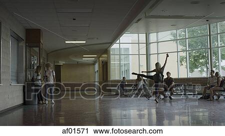 Students talking and dancing in school hallway View Large Photo Image Stock Image - Students talking and dancing in school hallway. Fotosearch