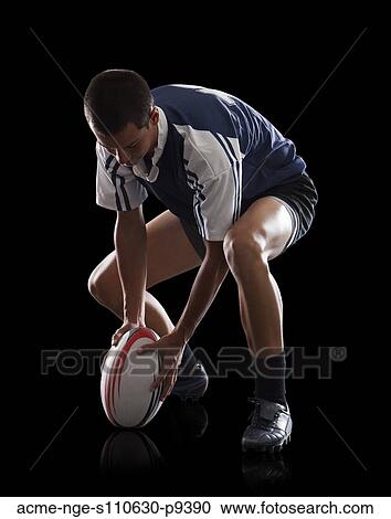 Studio portrait of teenage boy (14-15) with rugby ball View Large Photo Image Stock Image - Studio portrait of teenage boy (14-15) with rugby ball. Fotosearch