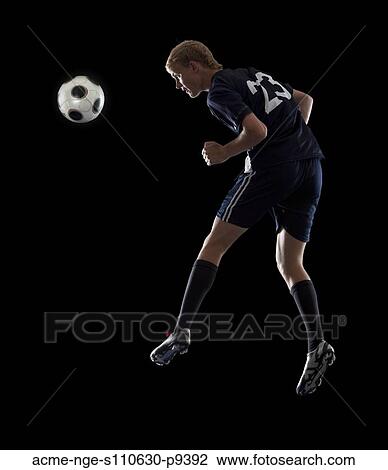 Studio portrait of teenage boy (16-17) with soccer ball View Large Photo Image Stock Image - Studio portrait of teenage boy (16-17) with soccer ball. Fotosearch