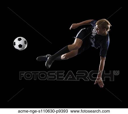 Studio portrait of teenage boy (16-17) with soccer ball View Large Photo Image Stock Image - Studio portrait of teenage boy (16-17) with soccer ball. Fotosearch