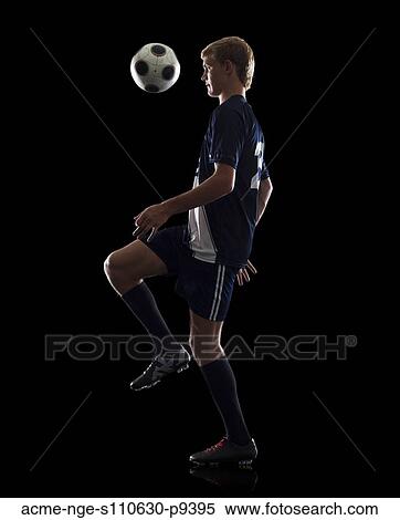 Studio portrait of teenage boy (16-17) with soccer ball View Large Photo Image Stock Photography - Studio portrait of teenage boy (16-17) with soccer ball. Fotosearch