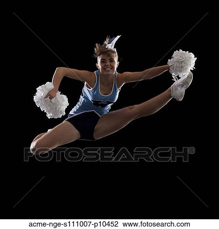 Studio shot of cheerleader (16-17) jumping View Large Photo Image Stock Image - Studio shot of cheerleader (16-17) jumping. Fotosearch