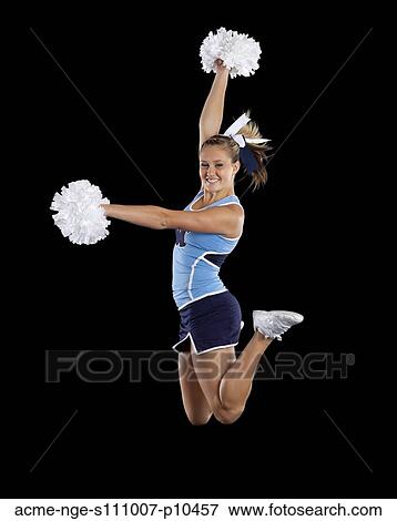 Studio shot of cheerleader (16-17) jumping View Large Photo Image Stock Photo - Studio shot of cheerleader (16-17) jumping. Fotosearch