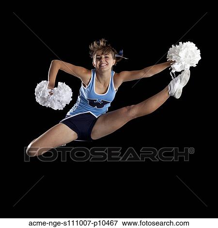 Studio shot of cheerleader (16-17) jumping View Large Photo Image Stock Photo - Studio shot of cheerleader (16-17) jumping. Fotosearch