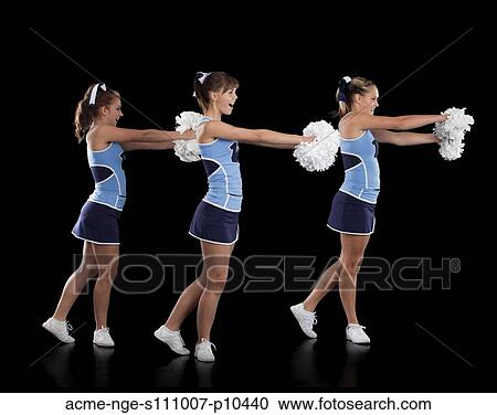 Studio shot of cheerleaders (16-17) dancing View Large Photo Image Stock Image - Studio shot of cheerleaders (16-17) dancing. Fotosearch