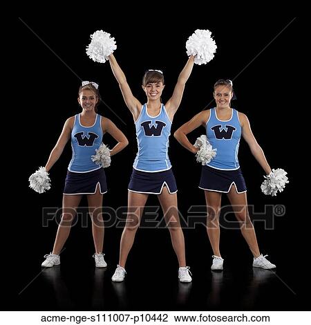 Stock Image - Studio shot of cheerleaders (16-17) dancing. Fotosearch