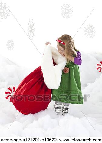 Studio shot of girl (18-23 months) peeking to Santa bag View Large Photo Image Stock Image - Studio shot of girl (18-23 months) peeking to Santa bag. Fotosearch