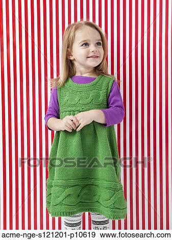 Studio shot of girl (18-23 months) smiling View Large Photo Image Stock Photo - Studio shot of girl (18-23 months) smiling. Fotosearch