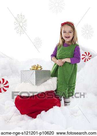 Studio shot of girl (18-23 months) with Christmas gifts View Large Photo Image Stock Image - Studio shot of girl (18-23 months) with Christmas gifts. Fotosearch