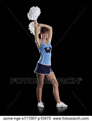 Stock Image - Studio shot of teenage (16-17) cheerleader. Fotosearch