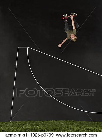 Stock Photo - Teenage boy (14-15) skateboarding in half pipe. Fotosearch