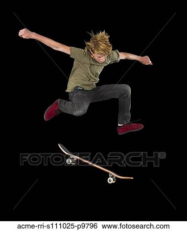 Teenage boy (14-15) skateboarding in half pipe View Large Photo Image Stock Photograph - Teenage boy (14-15) skateboarding in half pipe. Fotosearch