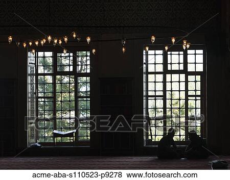 Turkey, Istanbul, Silhouette of two people sitting inside of Blue Mosque View Large Photo Image Stock Photo - Turkey, Istanbul, Silhouette of two people sitting inside of Blue Mosque. Fotosearch