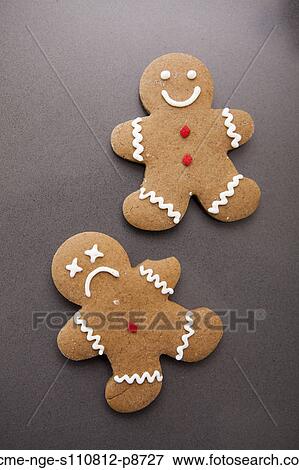 Two gingerbread men on grey background View Large Photo Image Stock Photo - Two gingerbread men on grey background. Fotosearch