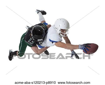 Two male players of American football fighting for ball, studio shot View Large Photo Image Stock Image - Two male players of American football fighting for ball, studio shot. Fotosearch