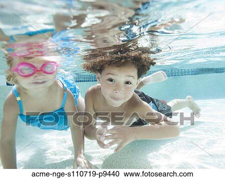 USA, Utah, Orem, Boy (4-5) and girl (2-3) swimming in pool View Large Photo Image Stock Image - USA, Utah, Orem, Boy (4-5) and girl (2-3) swimming in pool. Fotosearch