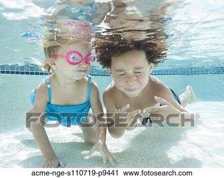 USA, Utah, Orem, Boy (4-5) and girl (2-3) swimming in pool View Large Photo Image Stock Image - USA, Utah, Orem, Boy (4-5) and girl (2-3) swimming in pool. Fotosearch
