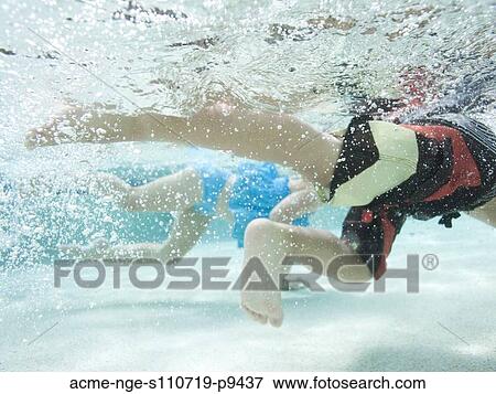 USA, Utah, Orem, Boy (4-5) and girl (2-3) swimming in pool View Large Photo Image Stock Photo - USA, Utah, Orem, Boy (4-5) and girl (2-3) swimming in pool. Fotosearch
