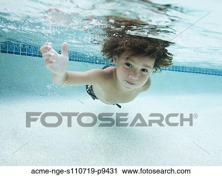USA, Utah, Orem, Boy (4-5) swimming in swimming pool View Large Photo Image Stock Image - USA, Utah, Orem, Boy (4-5) swimming in swimming pool. Fotosearch