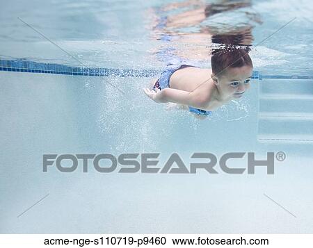 USA, Utah, Orem, Boy (6-7) swimming in pool View Large Photo Image Stock Image - USA, Utah, Orem, Boy (6-7) swimming in pool. Fotosearch