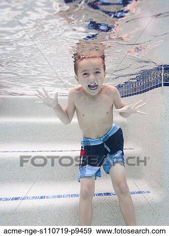 USA, Utah, Orem, Boy (6-7) swimming in pool View Large Photo Image Stock Photo - USA, Utah, Orem, Boy (6-7) swimming in pool. Fotosearch