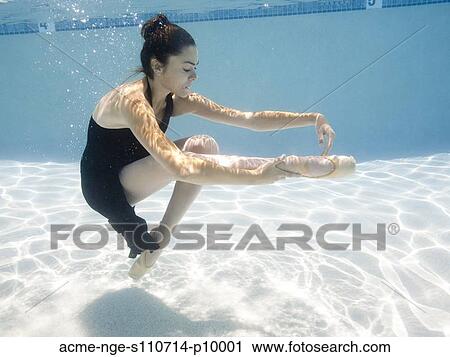 Stock Image - USA, Utah, Orem, Female ballet dancer under water. Fotosearch