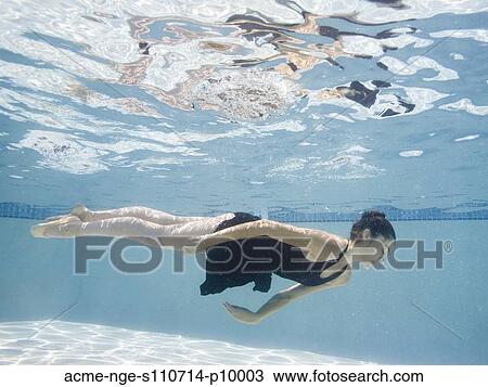 Stock Image - USA, Utah, Orem, Female ballet dancer under water. Fotosearch