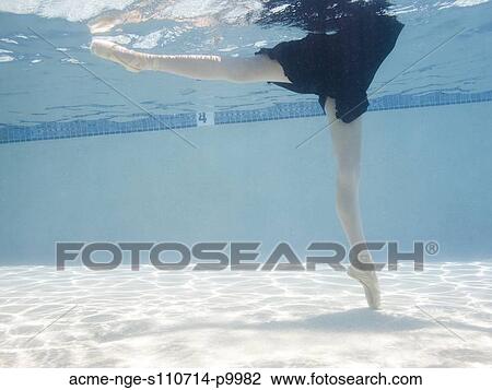 Stock Image - USA, Utah, Orem, Female ballet dancer under water. Fotosearch