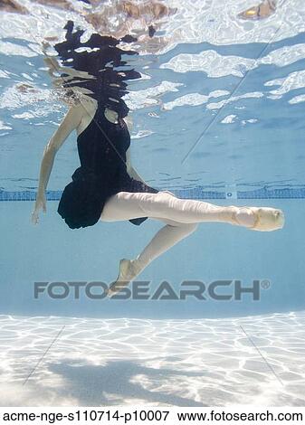 Stock Photo - USA, Utah, Orem, Female ballet dancer under water. Fotosearch