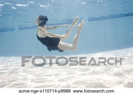 Stock Photo - USA, Utah, Orem, Female ballet dancer under water. Fotosearch