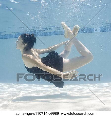 Stock Photo - USA, Utah, Orem, Female ballet dancer under water. Fotosearch