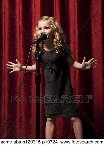 USA, Utah, Orem, Portrait of girl (8-9) singing with microphone View Large Photo Image Picture - USA, Utah, Orem, Portrait of girl (8-9) singing with microphone. Fotosearch