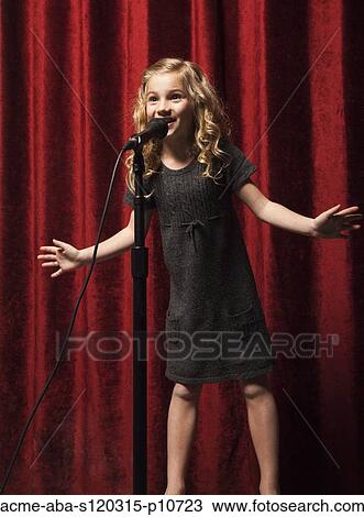 USA, Utah, Orem, Portrait of girl (8-9) singing with microphone View Large Photo Image Stock Image - USA, Utah, Orem, Portrait of girl (8-9) singing with microphone. Fotosearch